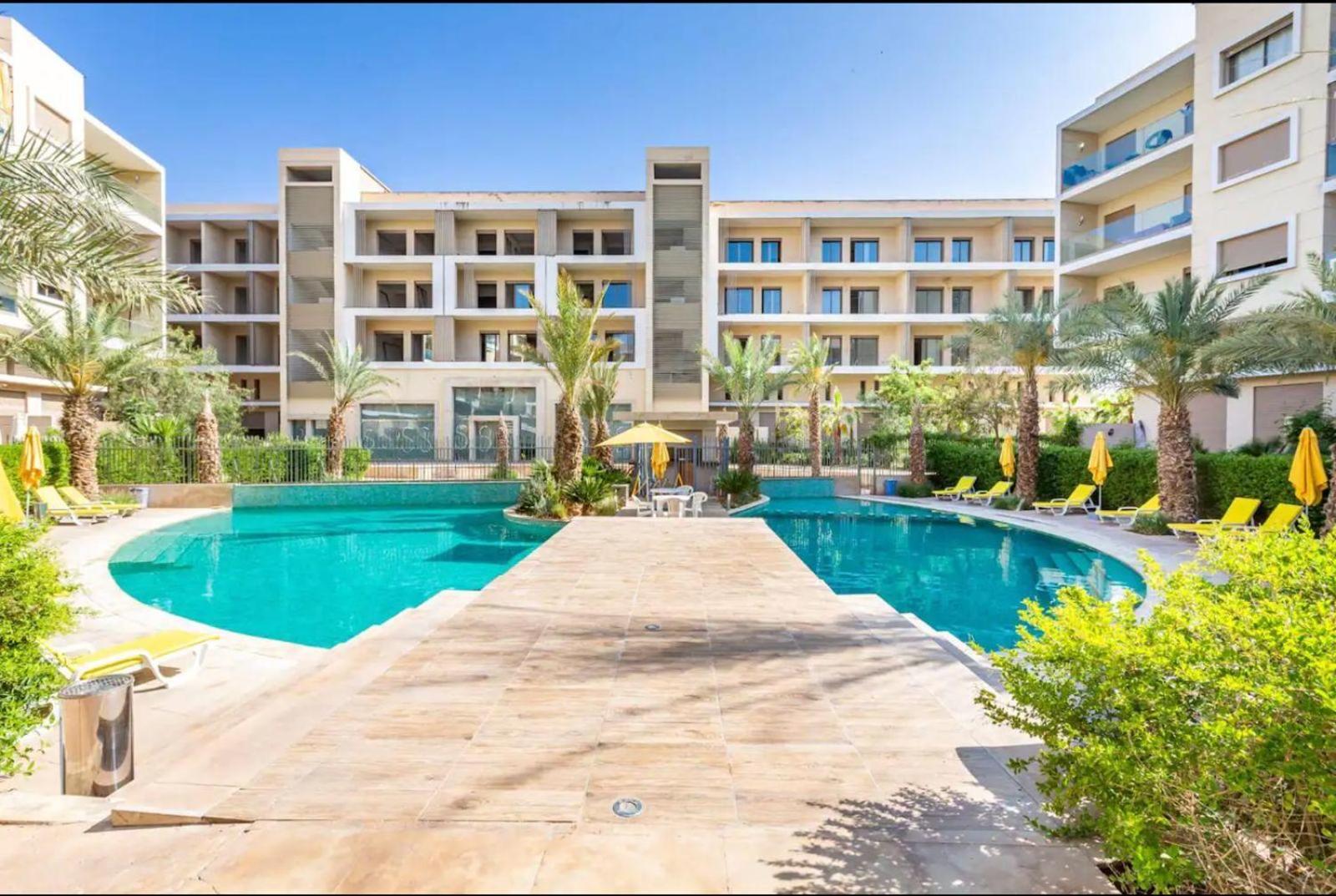 Appartement Luxueux Avec Piscine 10 Minutes Du Centre Ville マラケシュ エクステリア 写真